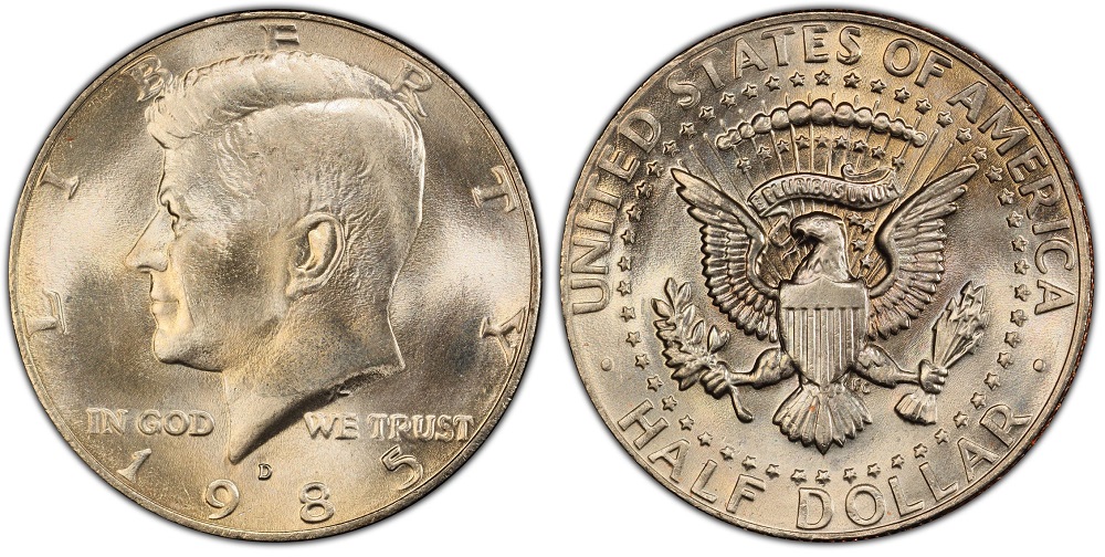 Grading strip showing four 1985 Kennedy Half Dollars from worn to gem condition: VF, AU, MS63, and MS66